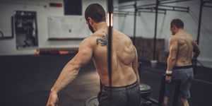 Shirtless men training hard