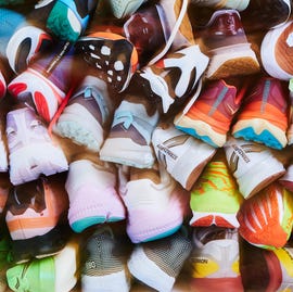 RWD a pile of running shoes stacked on top of each other
