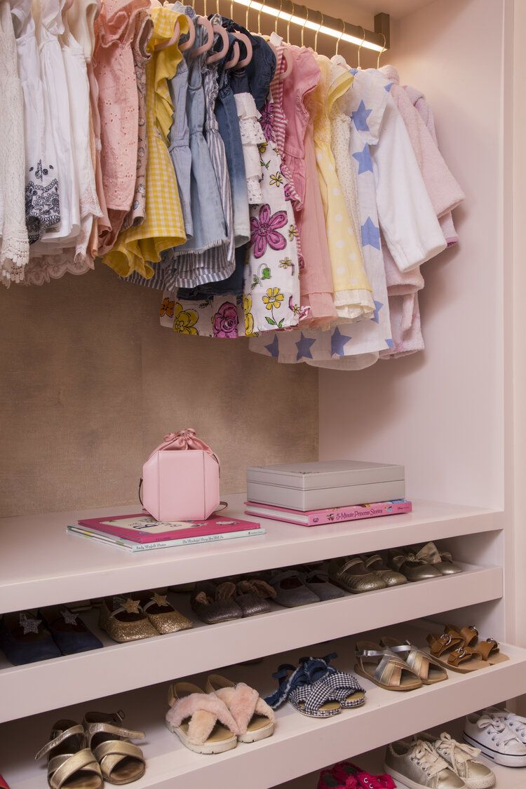 little girls closet with custom shoe drawers