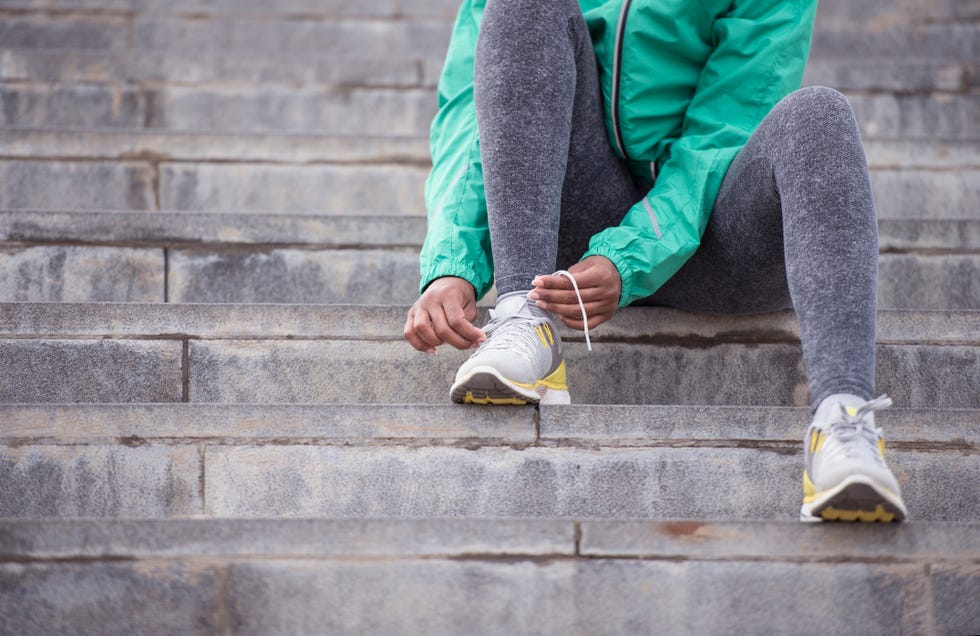 Shoelace tying of running shoes.