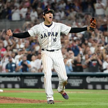 shohei ohtani screaming after throwing the final pitch of a baseball game