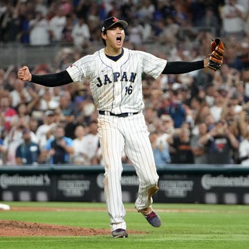 shohei ohtani screaming after throwing the final pitch of a baseball game