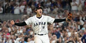 shohei ohtani screaming after throwing the final pitch of a baseball game