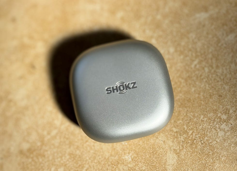 a grey shokz headphone case