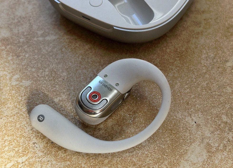 a grey shokz open earbud