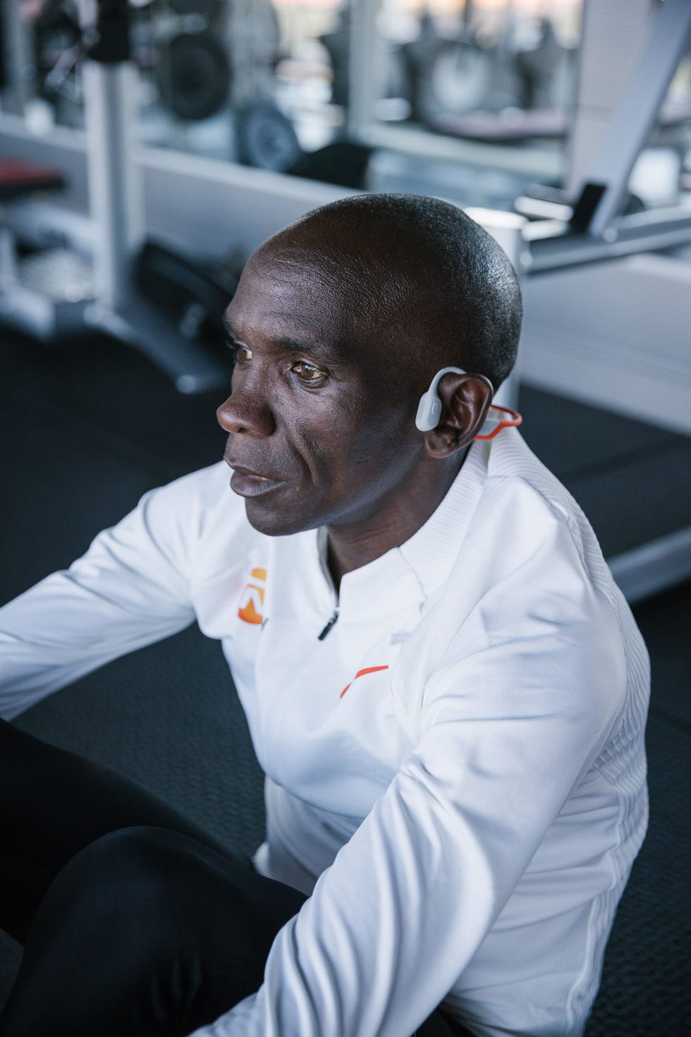 eliud kipchoge in the gym while wearing headphones