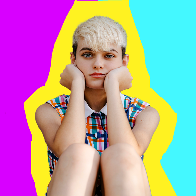 girl with hands on face pink yellow blue background