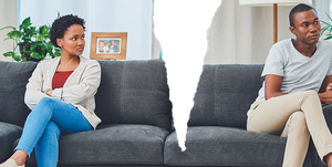 woman and man on couch angry at each other