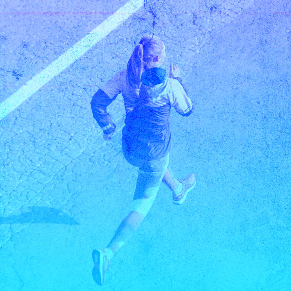 girl running blue background overlay