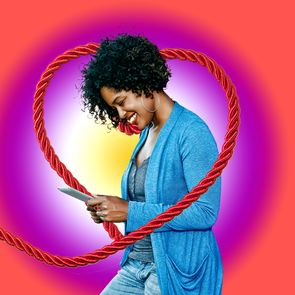 woman happy on phone red rope colorful background
