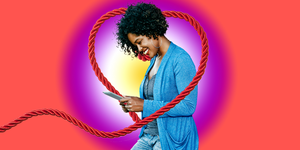 woman happy on phone red rope colorful background