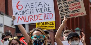 women protesting shooting of asian women