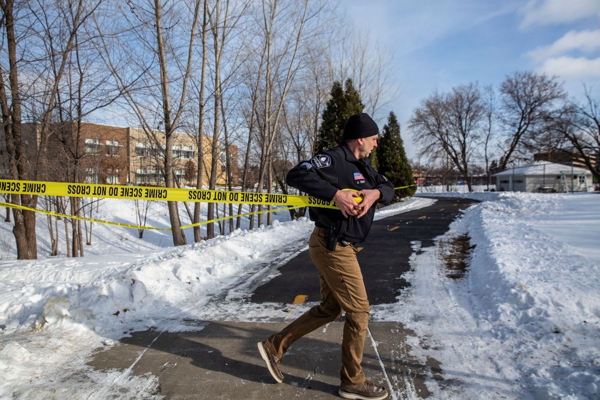 police work in front of south education center academy in richfield, minnesota, on february 1, 2022   two campus police officers were shot and killed at a college in the us state of virginia tuesday, while one student was killed and another wounded in a shooting at a school in minnesota the same day photo by kerem yucel  afp photo by kerem yucelafp via getty images