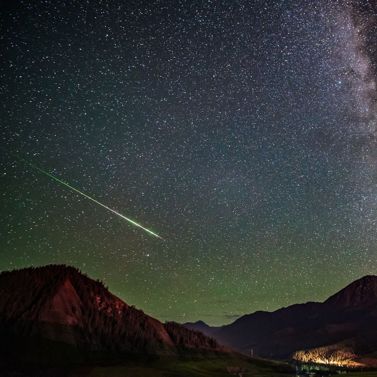 meteor streaking across night sky