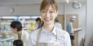shop assistant in convinience store, smiling