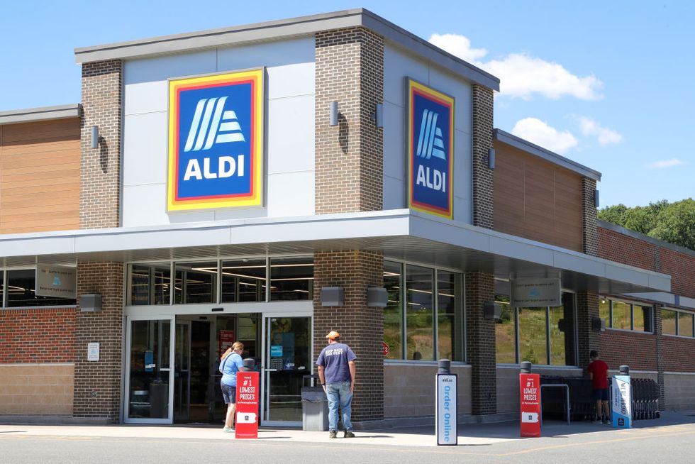 shoppers are seen outside of an aldi grocery store