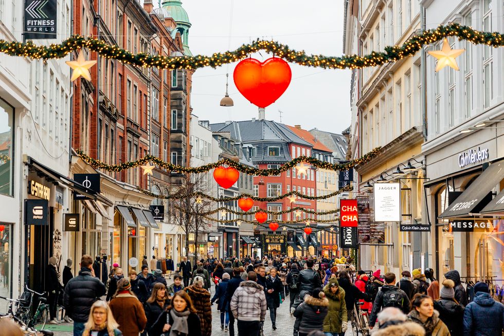 shopping street in historical center of copenhagen decorated for christmas holidays, denmark