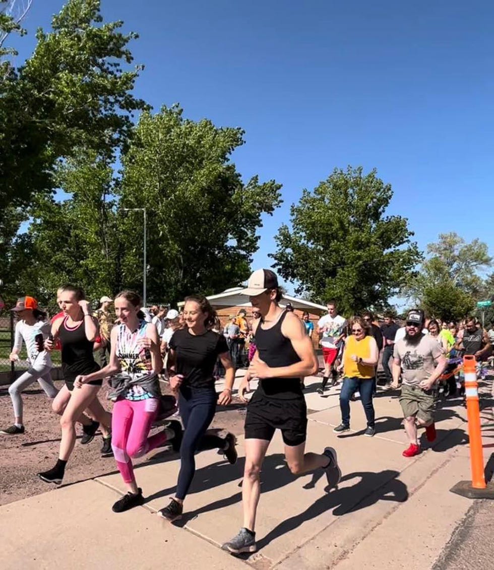 a group of people in a running race