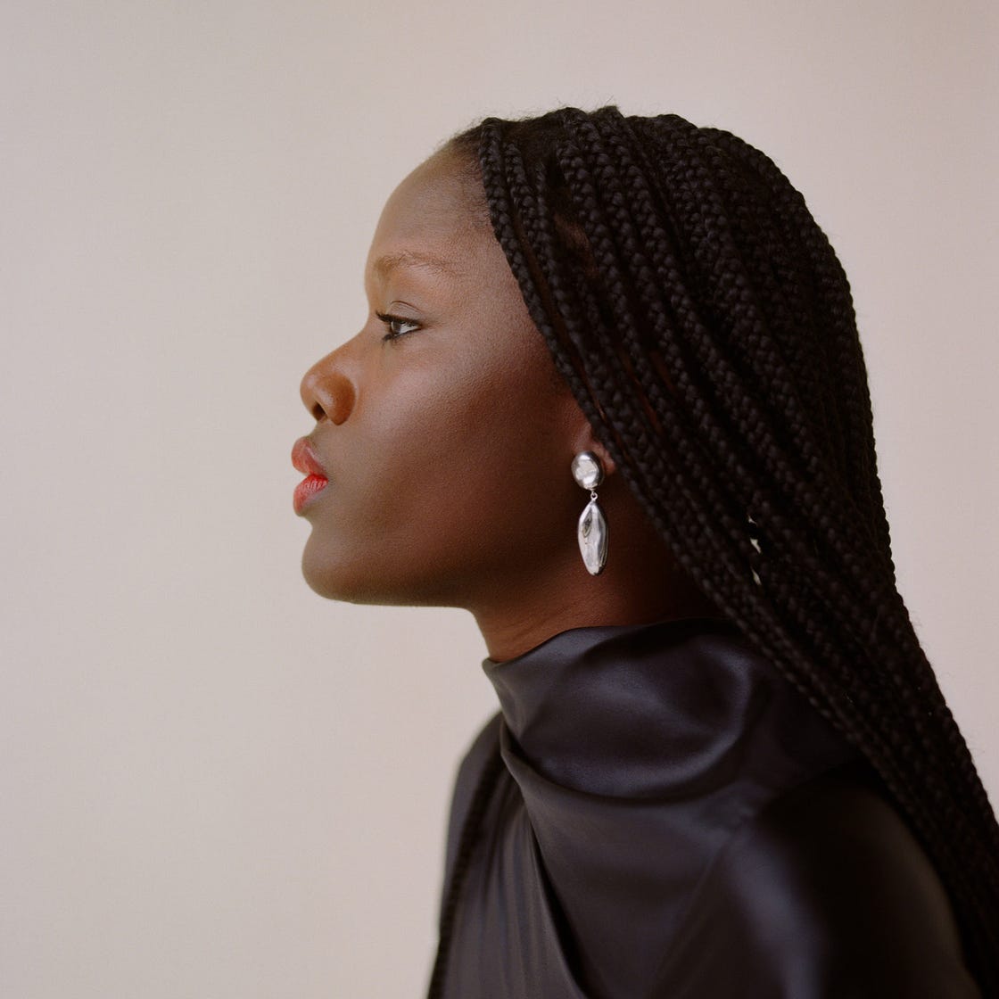 woman modeling silver earrings