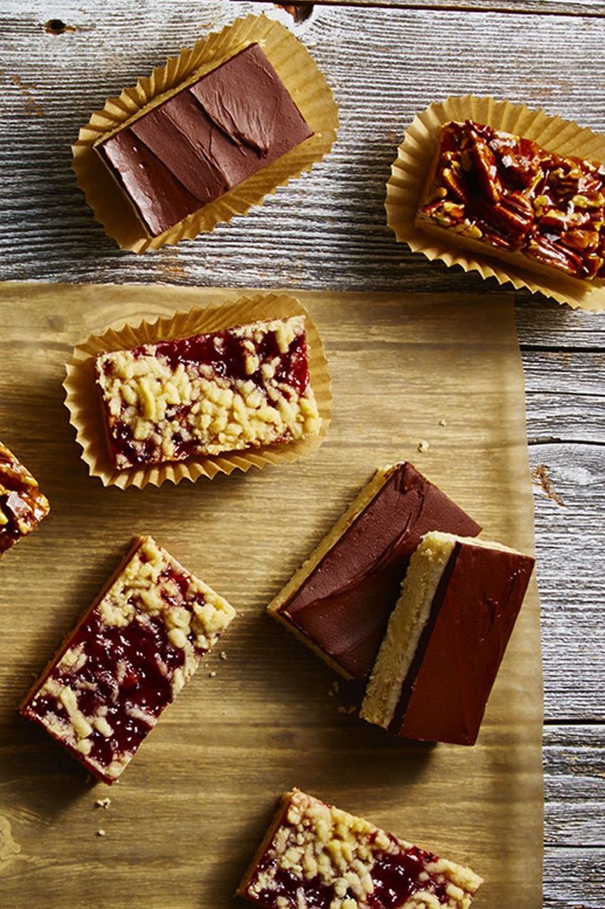 several chocolate shortbread squares on a wooden table