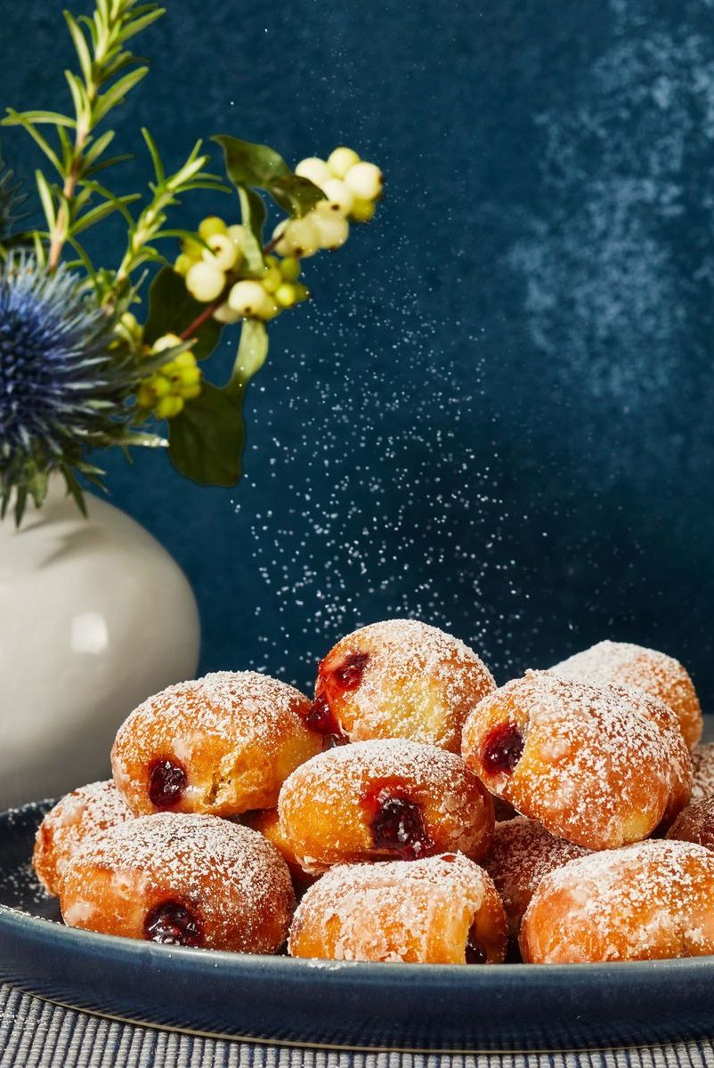mini jelly filled doughnuts with powdered sugar dusted on top