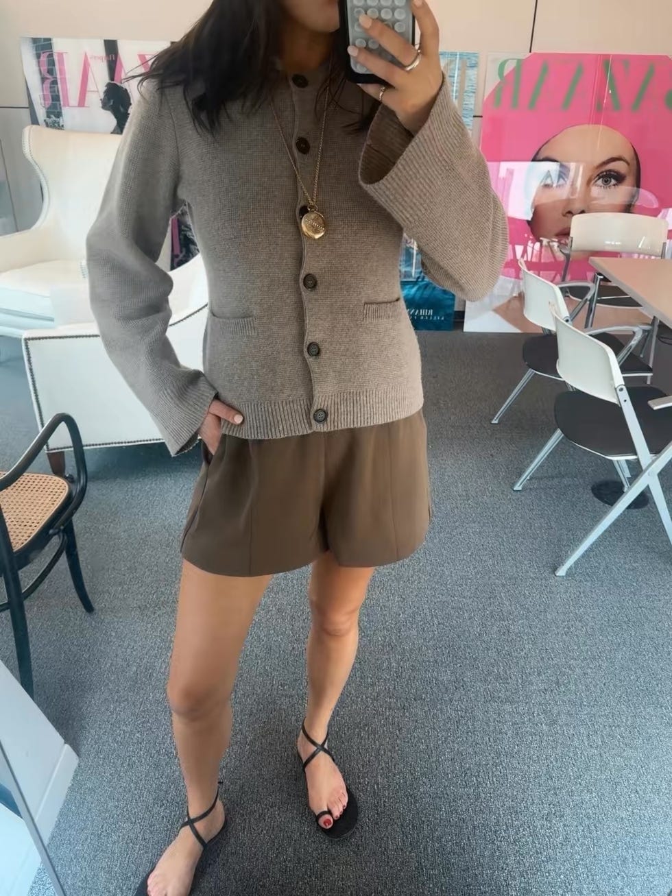 casual outfit showcased in a mirror selfie featuring a brown cardigan and shorts