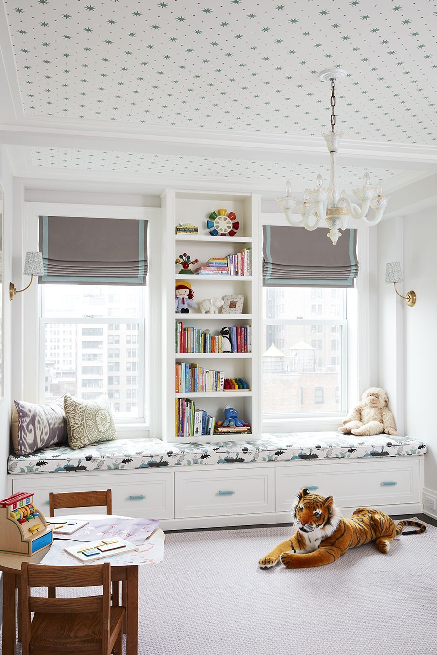 a room with a white shelf and a table with a dog on it