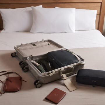 Trunk suitcase in ‘Sandstone’, Antler a suitcase on a bed
