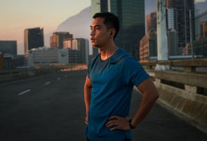 shot of a handsome young man taking a moment to catch his breath after a morning run in the city