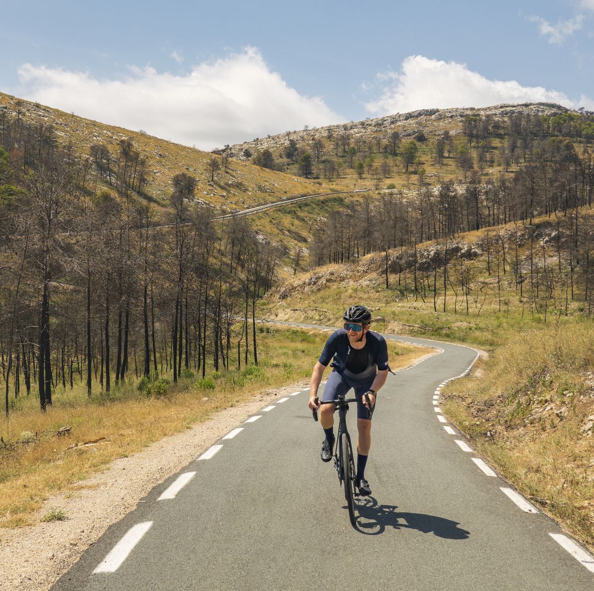 shot of a mature cyclist on a climb in the spanish mountains near jalonxalo
