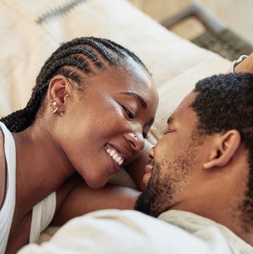 shot of a young couple being intimate in bed at home