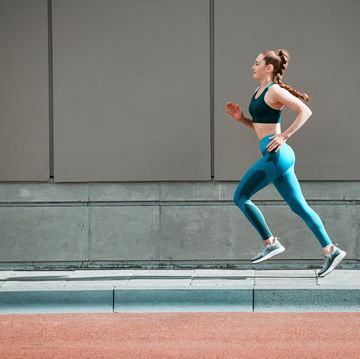 shot of a young woman running XL01 outside
