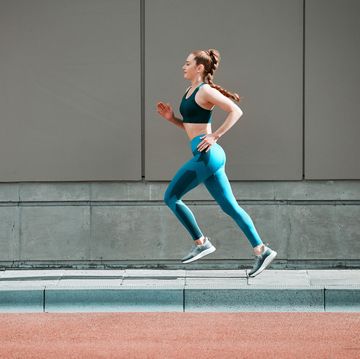 shot of a young woman steps running outside