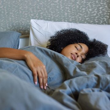 shot of a young woman sleeping in her bed at home