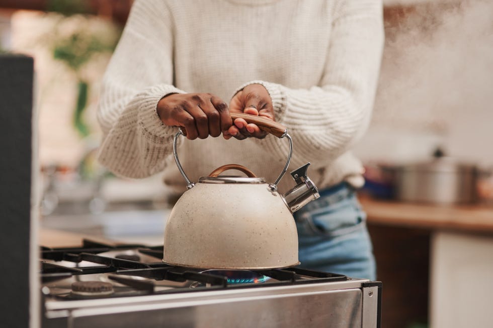 shot of an unrecognizable person boiling water on the stove at home