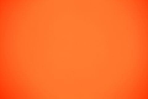 shot of orange colored paper background