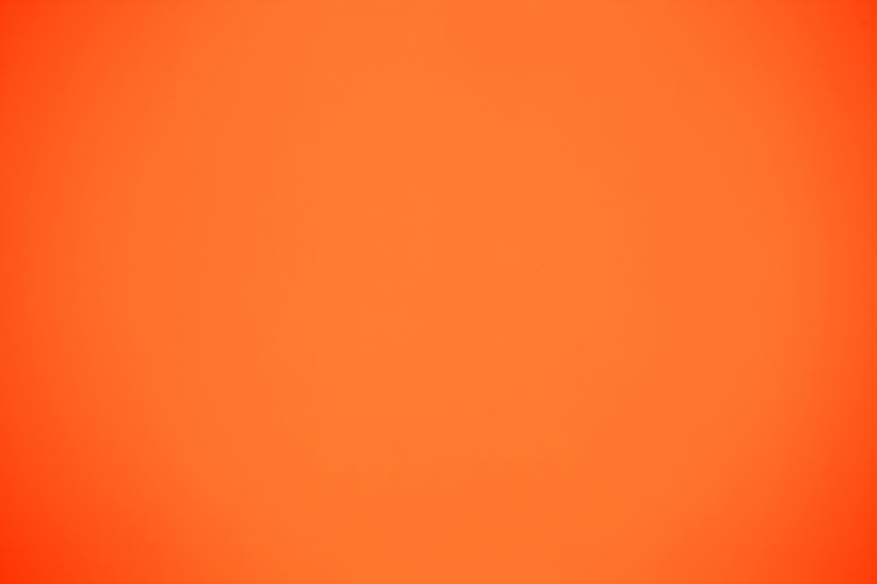 shot of orange colored paper background