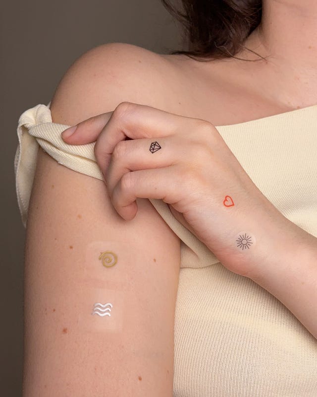 skin featuring temporary tattoos in various designs