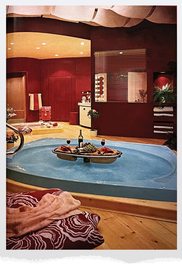 blue jacuzzi with a board of food and wine on it