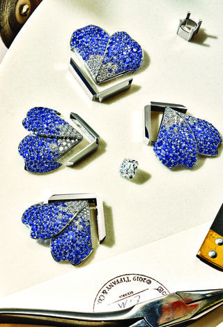 pieces of a diamond brooch to be assembled
