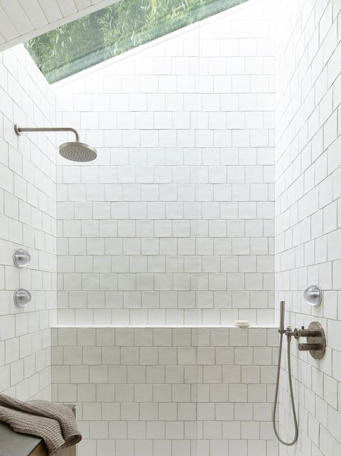 white small bathroom with glass enclosure
