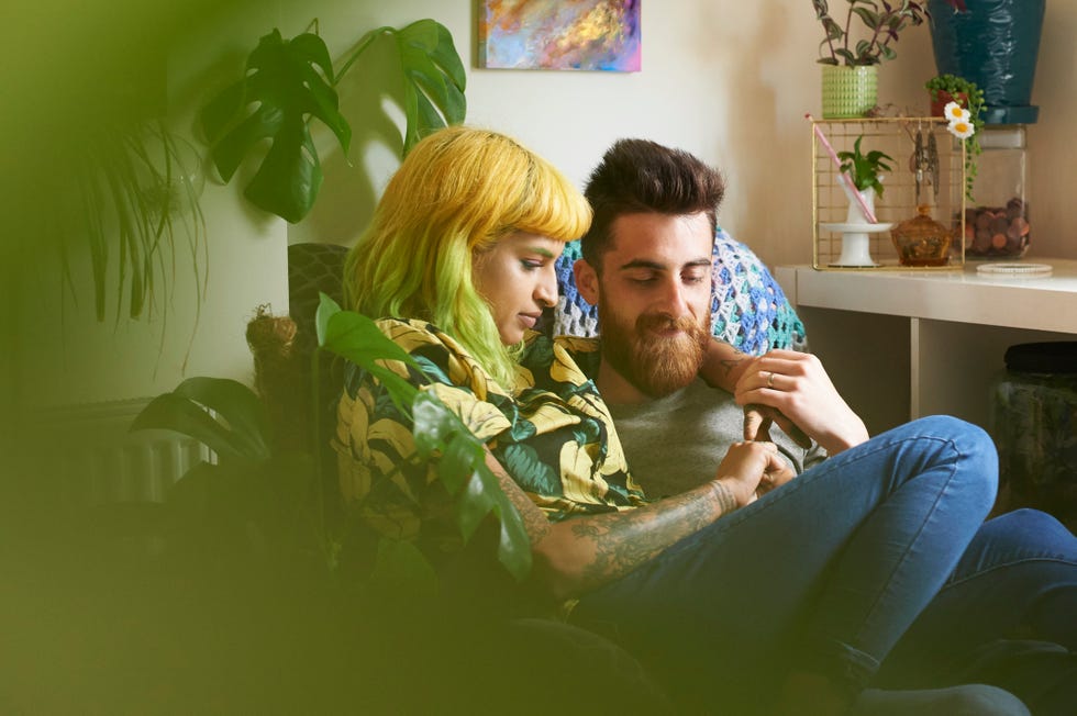 couple sat together in living room