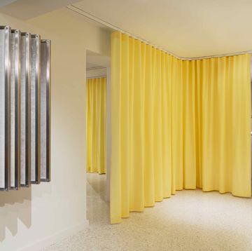 a room with yellow curtains