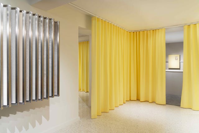 a room with yellow curtains