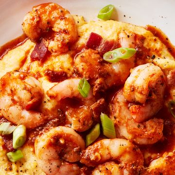 shrimp and grits in a bowl with greens onion