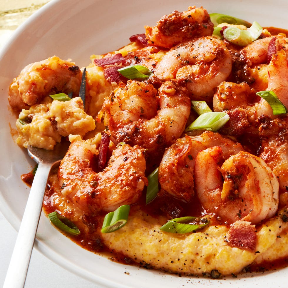 shrimp and grits in a bowl with greens onion
