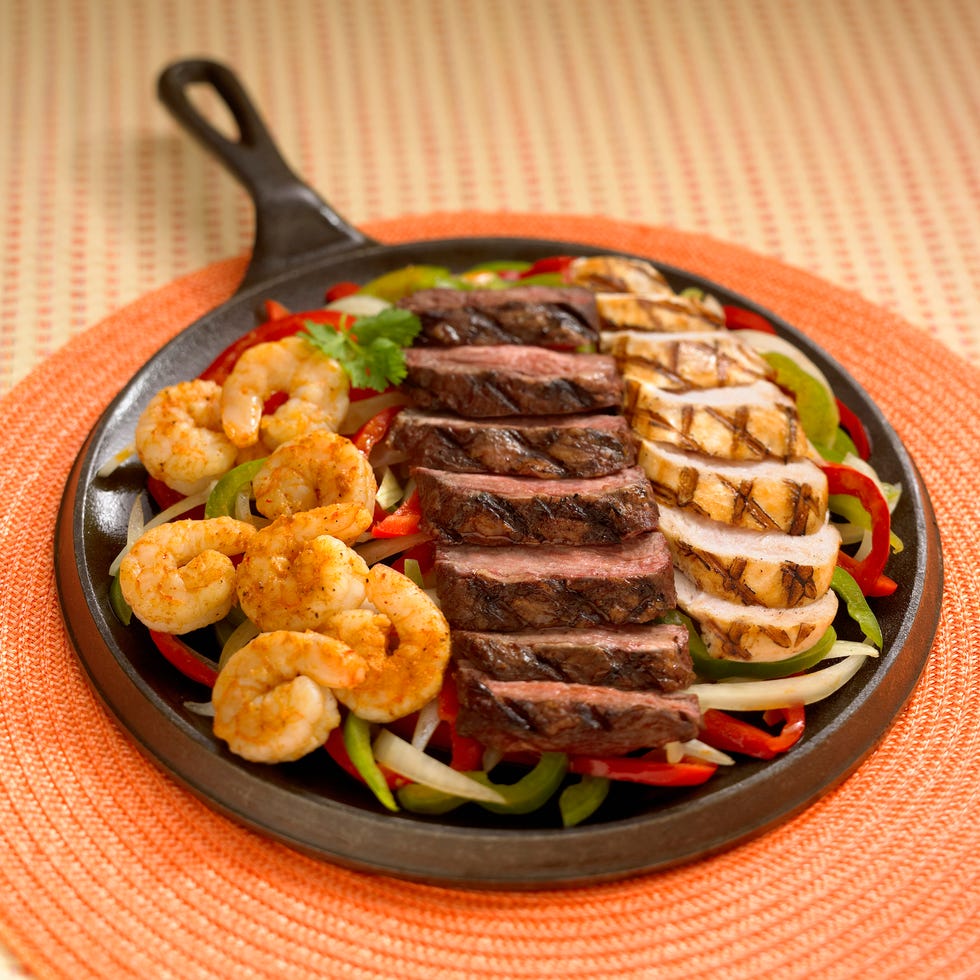 shrimp , beef and chicken in griddle