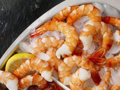 shrimp on ice with cocktail sauce