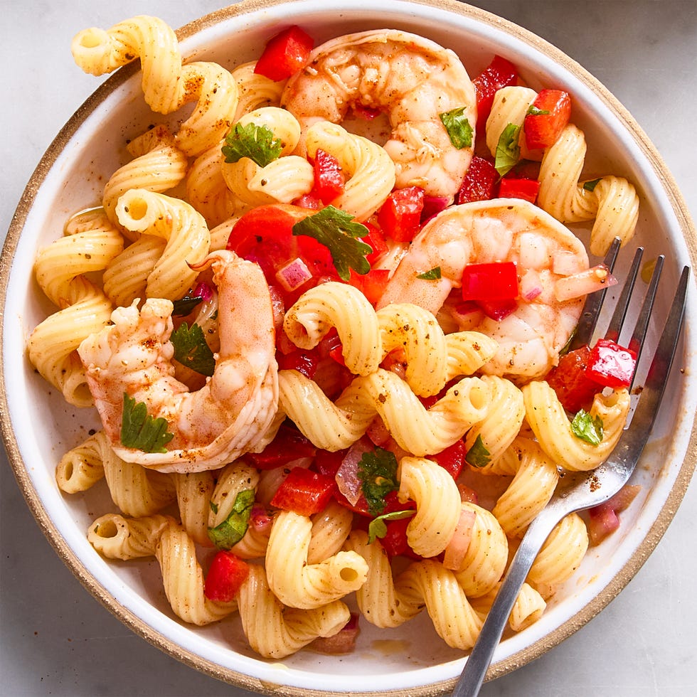 shrimp pasta salad with chopped tomatoes and red onion
