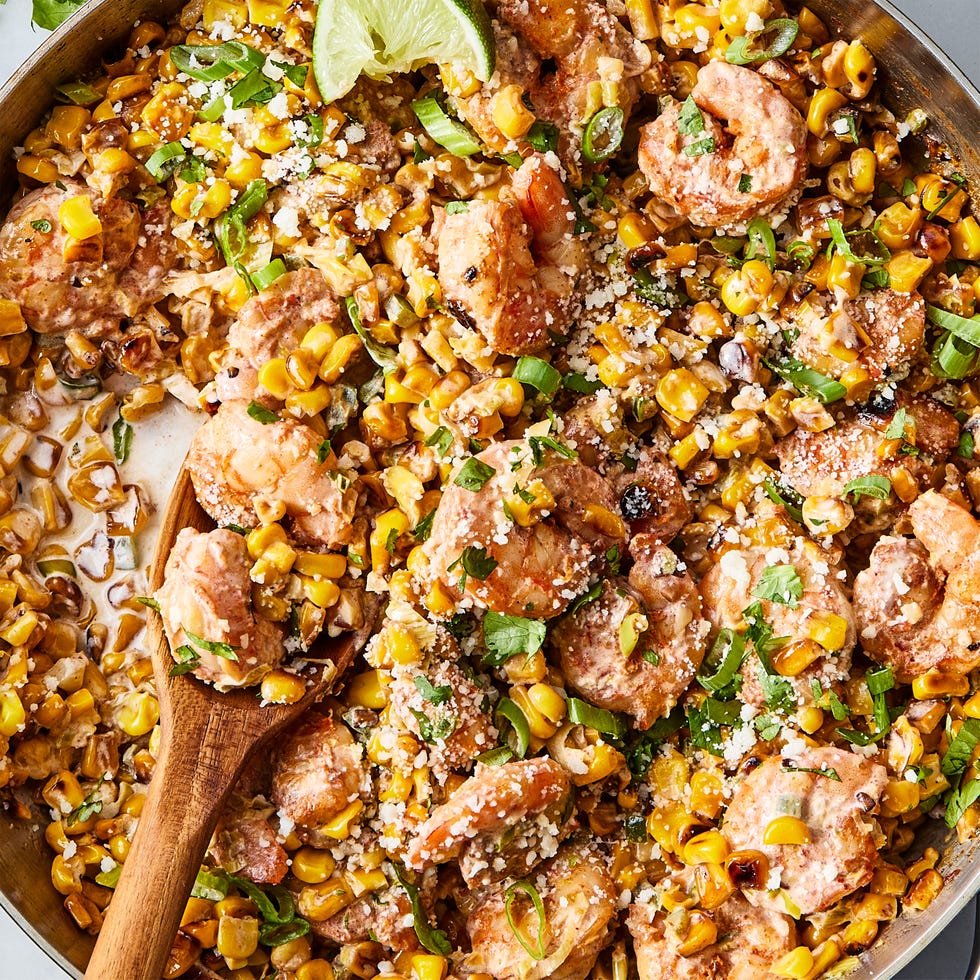 sweet corn is lightly browned in butter, then cooked with scallions, jalapeños, and garlic, tossed in chipotle chili powder and lime zest, then cooked alongside the corn before being smothered in a citrusy crema and topped with a flurry of cotija cheese and fresh cilantro